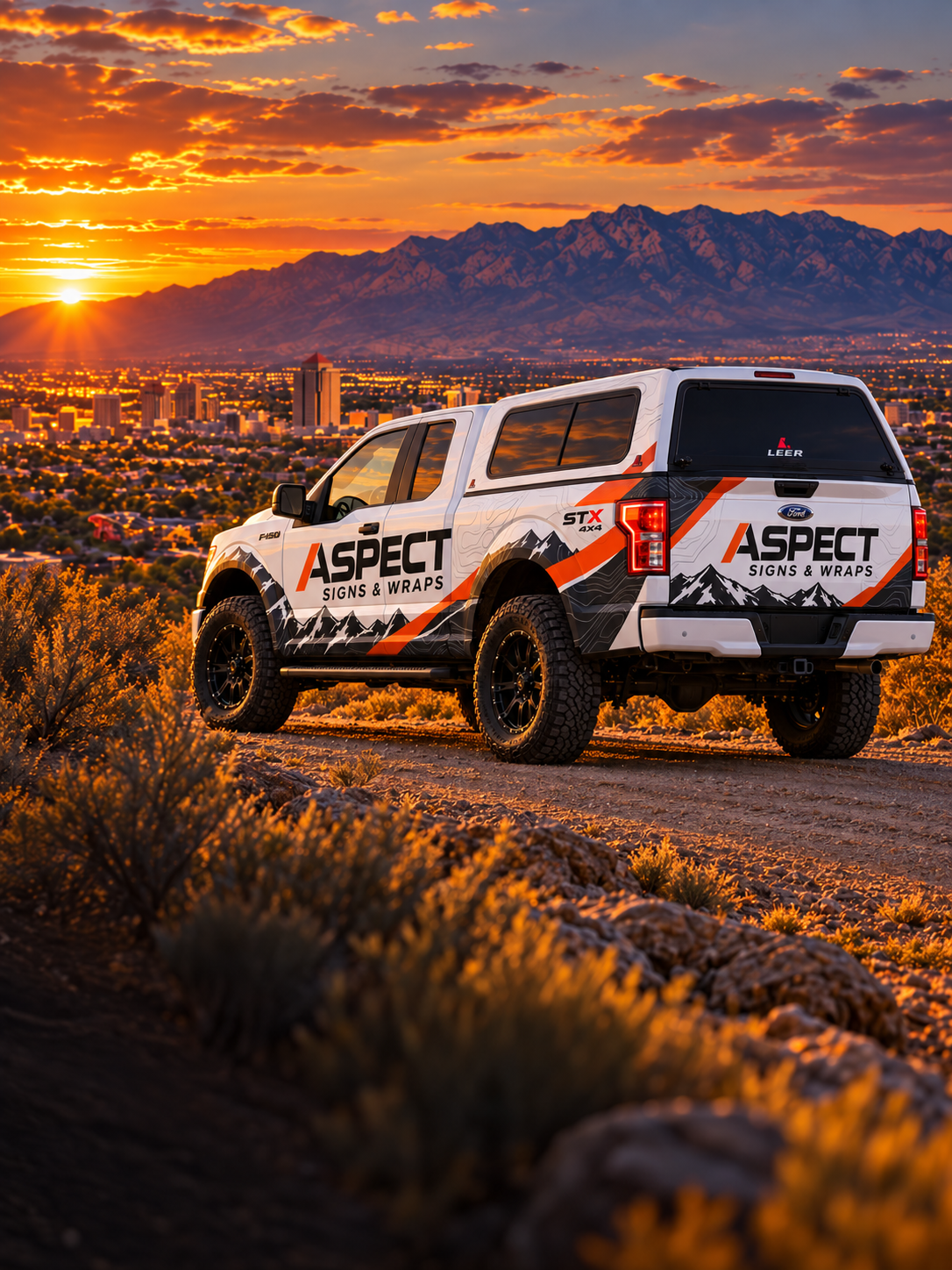 Aspect Signs & Wraps truck overlooking Albuquerque at sunset